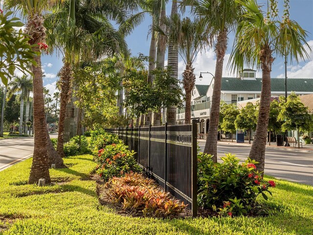 view of community featuring fence