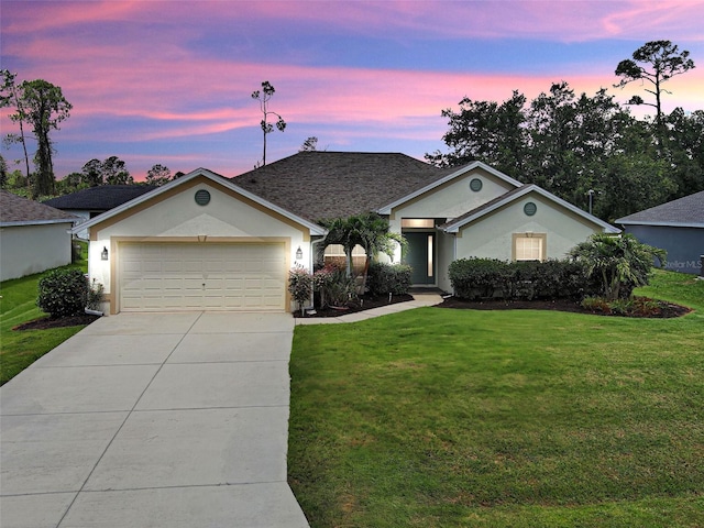 4103 Kinlock St, North Port, FL 34286 - ranch-style house with driveway, a yard, a garage, and stucco siding