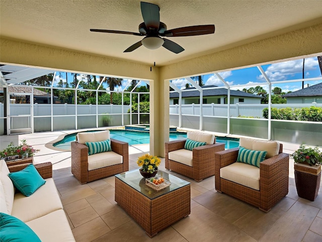 4103 Kinlock St, North Port, FL 34286 - fenced backyard with a patio, ceiling fan, glass enclosure, and an in-ground hot tub