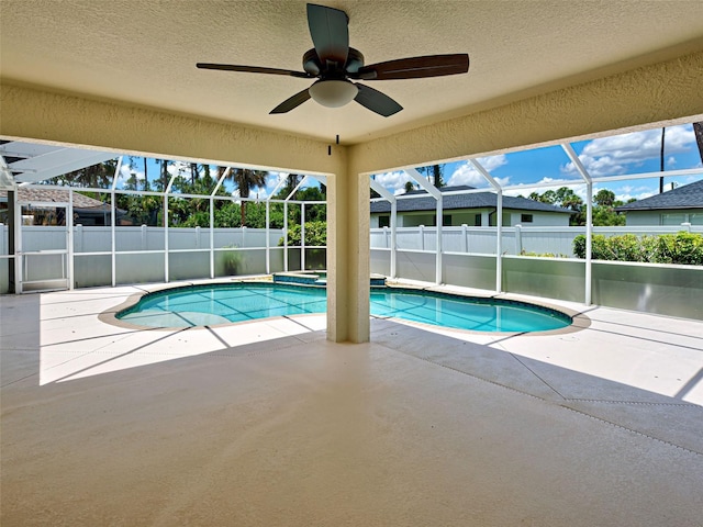 4103 Kinlock St, North Port, FL 34286 - view of swimming pool with a patio, a fenced backyard, a lanai, a ceiling fan, and a pool with connected hot tub