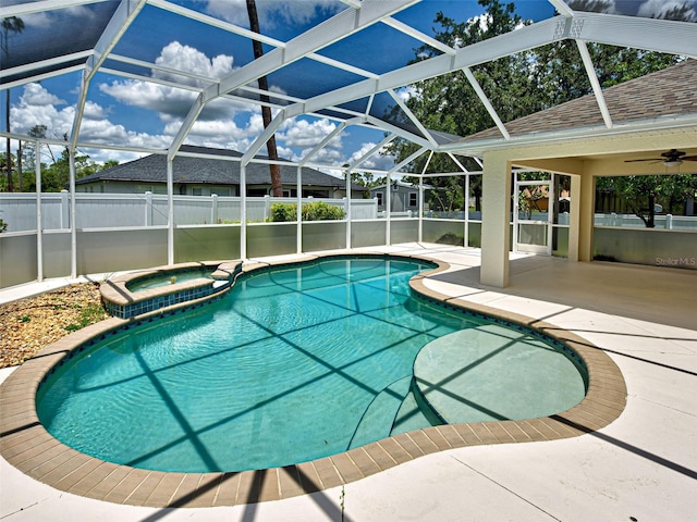 4103 Kinlock St, North Port, FL 34286 - view of pool with a patio area, a ceiling fan, a pool with connected hot tub, and glass enclosure