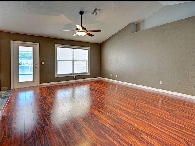 4103 Kinlock St, North Port, FL 34286 - unfurnished room with lofted ceiling, a ceiling fan, wood finished floors, and a textured wall