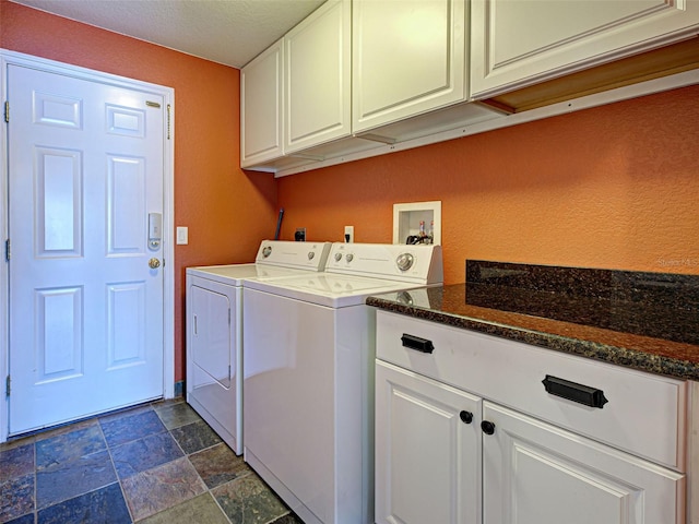 4103 Kinlock St, North Port, FL 34286 - laundry area featuring cabinet space, washer and dryer, dark stone finish floors, a textured ceiling, and a textured wall
