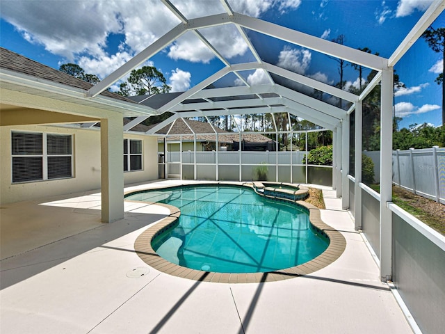 4103 Kinlock St, North Port, FL 34286 - view of swimming pool featuring a fenced backyard, a patio, a pool with connected hot tub, and a lanai