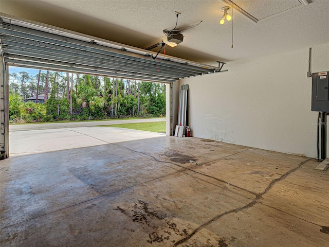 4103 Kinlock St, North Port, FL 34286 - garage with electric panel, a ceiling fan, and a garage door opener