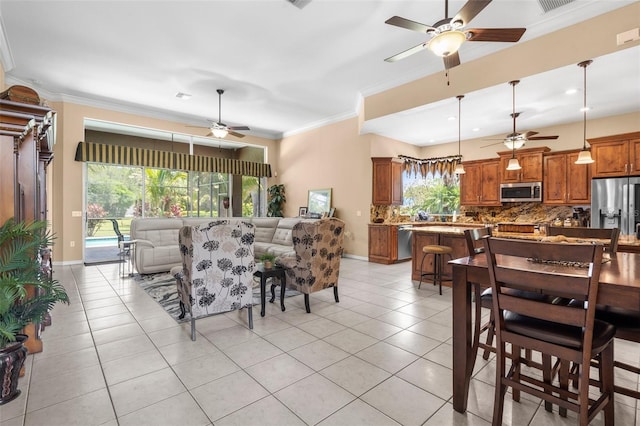 3950 Pepper Ln, North Port, FL 34287 - dining space with a ceiling fan, light tile patterned flooring, ornamental molding, and baseboards