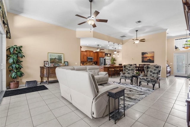 3950 Pepper Ln, North Port, FL 34287 - living room with ceiling fan, light tile patterned flooring, crown molding, and baseboards