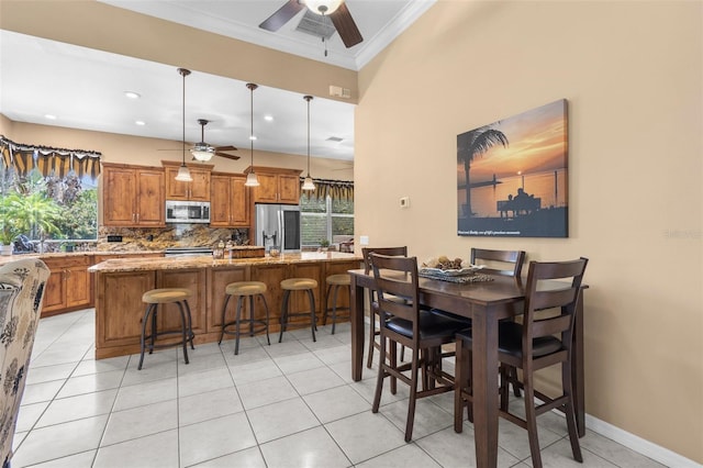 3950 Pepper Ln, North Port, FL 34287 - dining space with ceiling fan, ornamental molding, light tile patterned flooring, recessed lighting, and baseboards