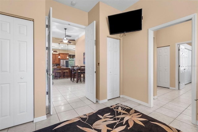 3950 Pepper Ln, North Port, FL 34287 - bedroom featuring stainless steel fridge, light tile patterned floors, ornamental molding, and baseboards