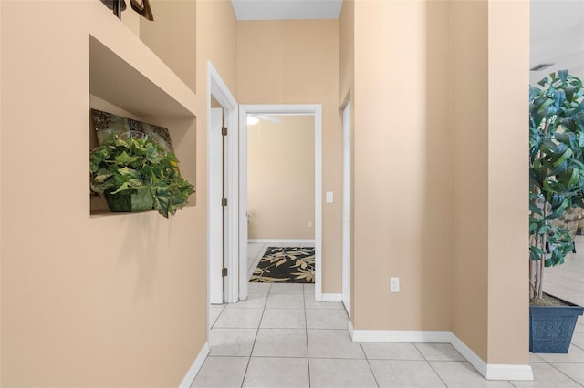 3950 Pepper Ln, North Port, FL 34287 - hallway with light tile patterned floors and baseboards