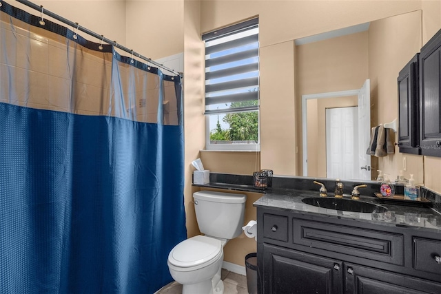 3950 Pepper Ln, North Port, FL 34287 - full bath featuring toilet, vanity, a shower with curtain, and tile patterned floors