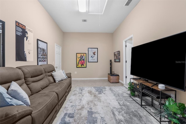 3950 Pepper Ln, North Port, FL 34287 - living area with attic access, light tile patterned flooring, and baseboards