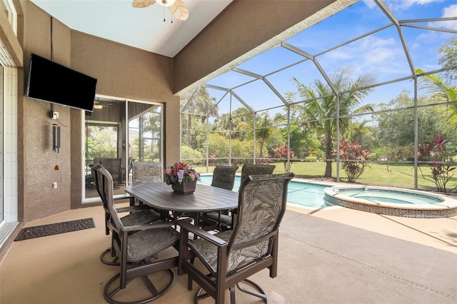 3950 Pepper Ln, North Port, FL 34287 - view of patio featuring ceiling fan, glass enclosure, a pool with connected hot tub, and outdoor dining space