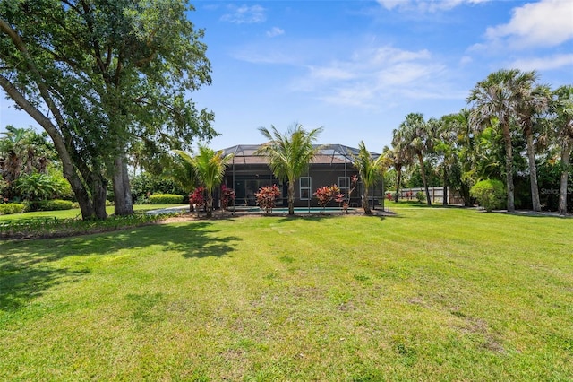 3950 Pepper Ln, North Port, FL 34287 - view of green lawn with a lanai