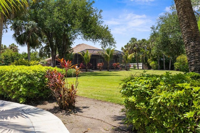 3950 Pepper Ln, North Port, FL 34287 - view of grassy yard featuring a lanai