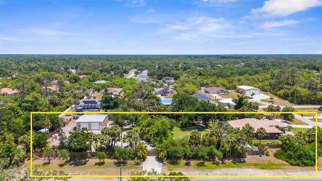 3950 Pepper Ln, North Port, FL 34287 - aerial perspective of suburban area featuring a heavily wooded area and property boundaries highlighted