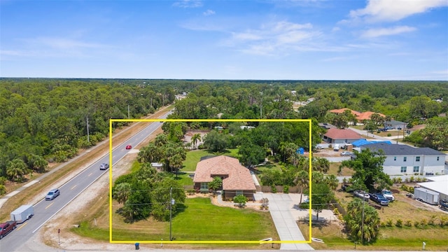 3950 Pepper Ln, North Port, FL 34287 - aerial view of property and surrounding area with a heavily wooded area and property boundaries highlighted