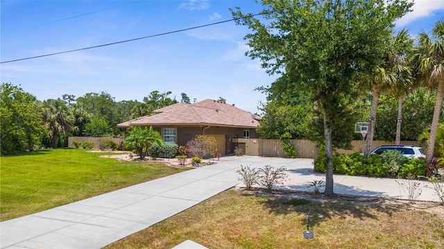3950 Pepper Ln, North Port, FL 34287 - view of front of house featuring concrete driveway, stucco siding, and a tile roof