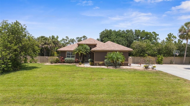 3950 Pepper Ln, North Port, FL 34287 - mediterranean / spanish-style home with a tiled roof and stucco siding