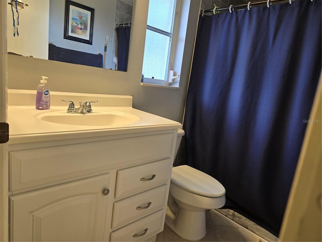 full bath with toilet, vanity, tile patterned flooring, and curtained shower