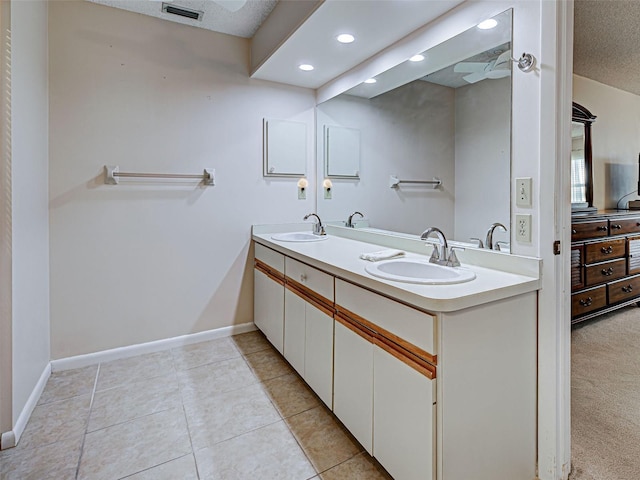 3141 Heron Shores Dr, Venice, FL 34293 - full bath featuring double vanity, tile patterned floors, and recessed lighting