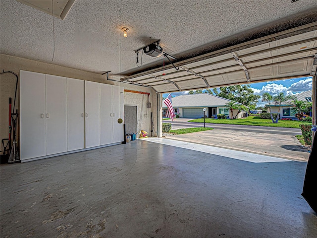 3141 Heron Shores Dr, Venice, FL 34293 - garage featuring a garage door opener