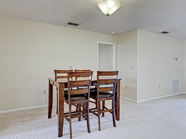 3141 Heron Shores Dr, Venice, FL 34293 - dining space with a textured ceiling and light carpet