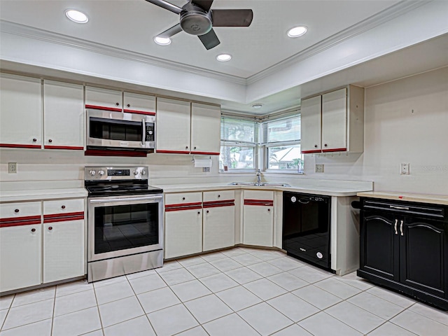 3141 Heron Shores Dr, Venice, FL 34293 - kitchen with stainless steel appliances, crown molding, light countertops, ceiling fan, and recessed lighting