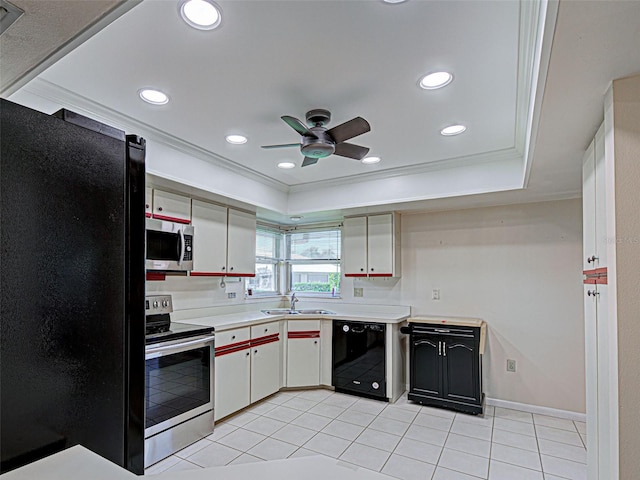 3141 Heron Shores Dr, Venice, FL 34293 - kitchen with black appliances, crown molding, a ceiling fan, light countertops, and light tile patterned floors