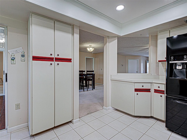 3141 Heron Shores Dr, Venice, FL 34293 - kitchen featuring black fridge with ice dispenser, light countertops, ornamental molding, light tile patterned floors, and light colored carpet