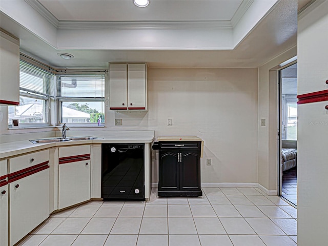 3141 Heron Shores Dr, Venice, FL 34293 - kitchen featuring black dishwasher, a raised ceiling, plenty of natural light, crown molding, and recessed lighting