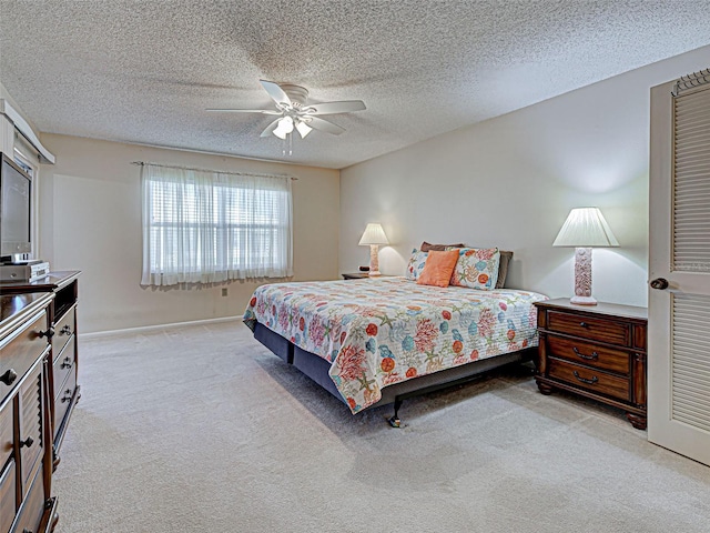 3141 Heron Shores Dr, Venice, FL 34293 - carpeted bedroom featuring a ceiling fan and a textured ceiling