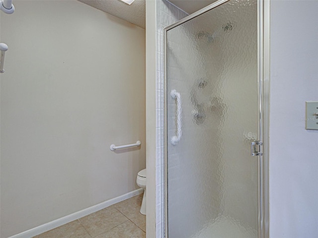 3141 Heron Shores Dr, Venice, FL 34293 - full bathroom featuring tile patterned floors, a stall shower, and a textured ceiling