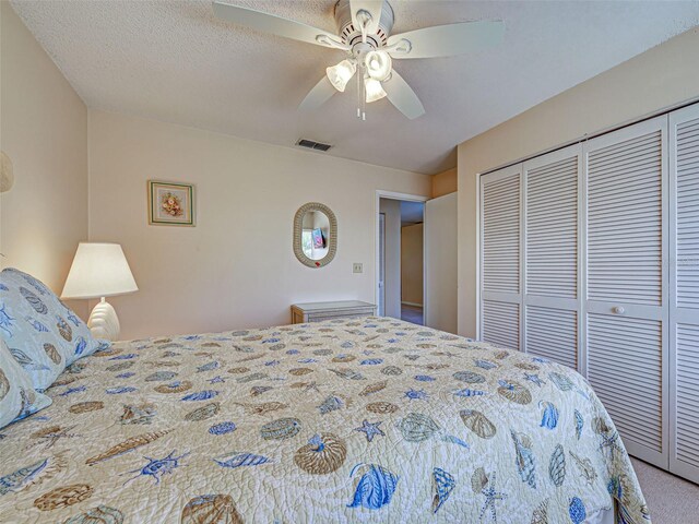 3141 Heron Shores Dr, Venice, FL 34293 - bedroom with a closet and ceiling fan