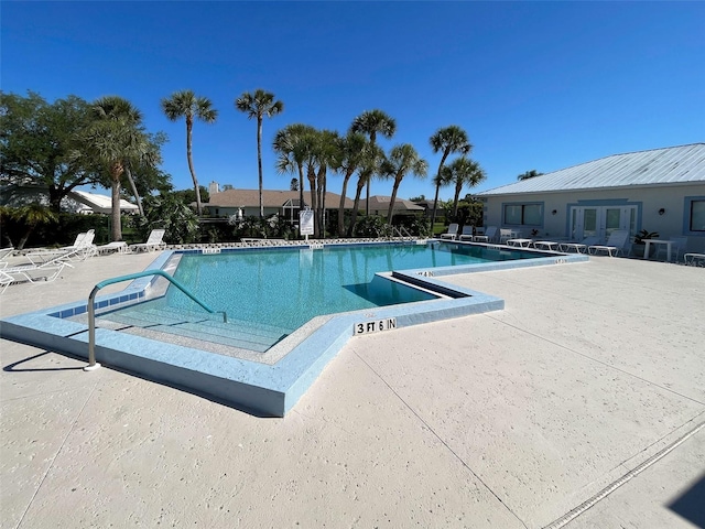3141 Heron Shores Dr, Venice, FL 34293 - community pool with a patio and french doors