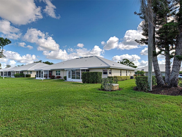 3141 Heron Shores Dr, Venice, FL 34293 - rear view of property with a yard