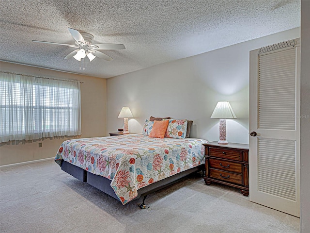 3141 Heron Shores Dr, Venice, FL 34293 - carpeted bedroom featuring a textured ceiling and ceiling fan