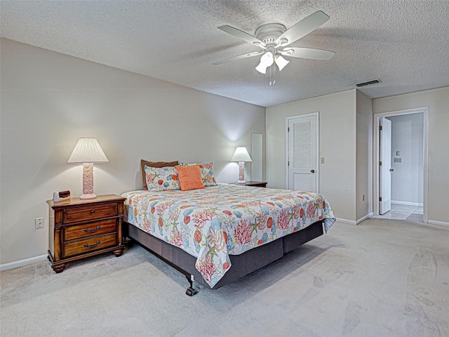 3141 Heron Shores Dr, Venice, FL 34293 - carpeted bedroom with a textured ceiling and a ceiling fan