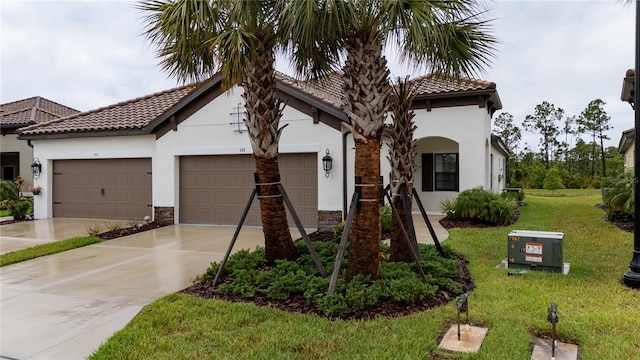 249 Tracino Ter, Nokomis, FL 34275 - mediterranean / spanish-style house featuring concrete driveway, a garage, stucco siding, and a tiled roof
