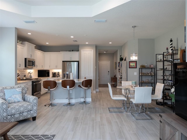 249 Tracino Ter, Nokomis, FL 34275 - living area featuring light wood-style floors and recessed lighting