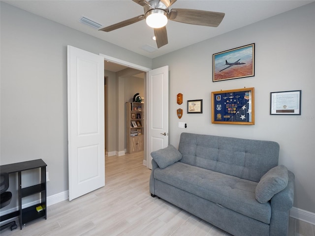 249 Tracino Ter, Nokomis, FL 34275 - living area with baseboards, light wood-style floors, and ceiling fan