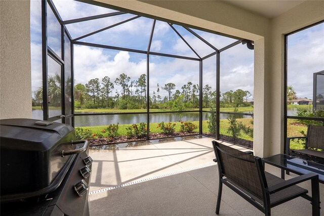 249 Tracino Ter, Nokomis, FL 34275 - sunroom / solarium with a water view and view of wooded area