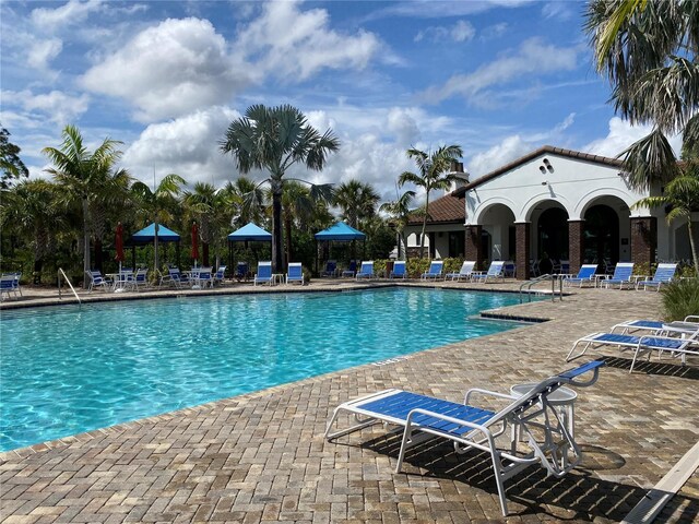 249 Tracino Ter, Nokomis, FL 34275 - community pool with a patio area