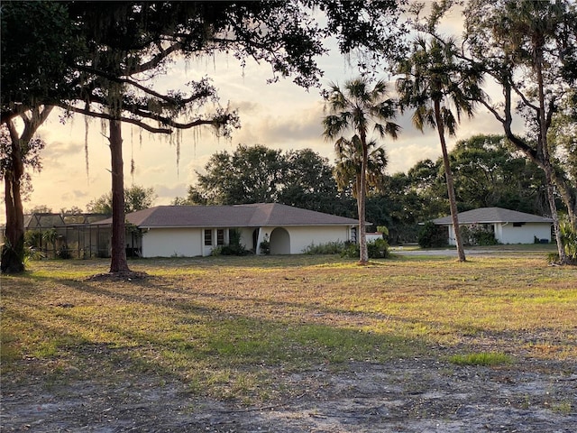 5760 Howard Creek Rd, Sarasota, FL 34241 - view of front of home with a front lawn