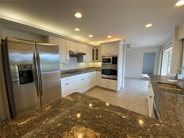 5760 Howard Creek Rd, Sarasota, FL 34241 - kitchen featuring appliances with stainless steel finishes, a sink, decorative backsplash, under cabinet range hood, and ceiling fan