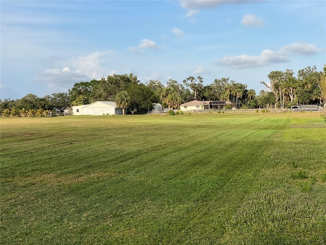 5760 Howard Creek Rd, Sarasota, FL 34241 - view of grassy yard featuring view of scattered trees