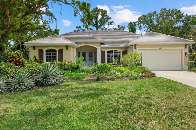 427 Autumn Chase Dr, Venice, FL 34292 - single story home with stucco siding and a front lawn