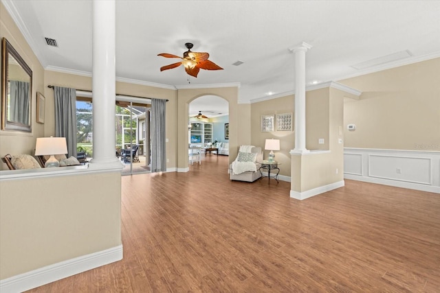 427 Autumn Chase Dr, Venice, FL 34292 - living room with ceiling fan, decorative columns, ornamental molding, wood finished floors, and arched walkways