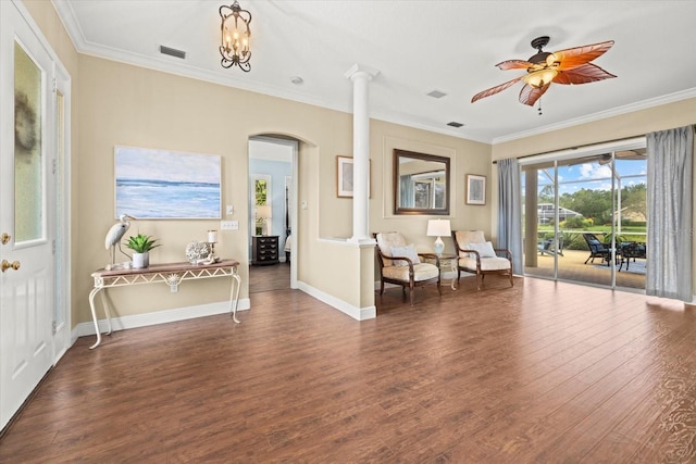 427 Autumn Chase Dr, Venice, FL 34292 - living area with arched walkways, ornate columns, wood finished floors, crown molding, and ceiling fan
