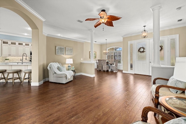 427 Autumn Chase Dr, Venice, FL 34292 - living room featuring ornate columns, dark wood finished floors, ceiling fan, baseboards, and ornamental molding